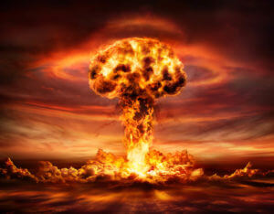 A nuclear bomb explosion caused a mushroom cloud during nuclear testing similar to Bikini Atoll.