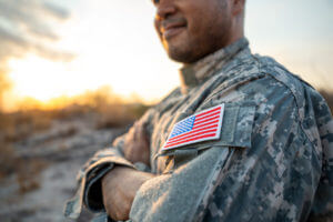 US veteran holding American flag