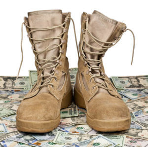 Army boots on background of money for illustrating veteran compensation.