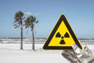 Nuclear radiation warning sign in front of a beach